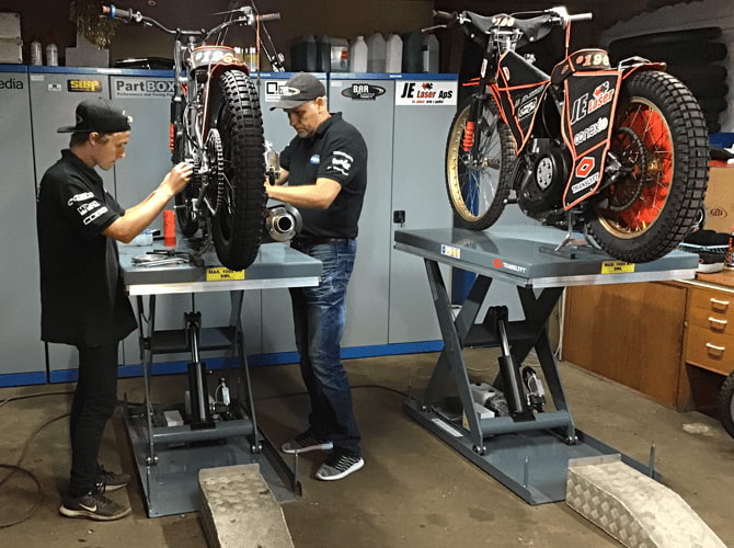 Julle racing team fixing their speedway bikes on translyft scissor lift tables - compressed